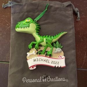 Christmas ornament / dinosaur says “Michael 2022”